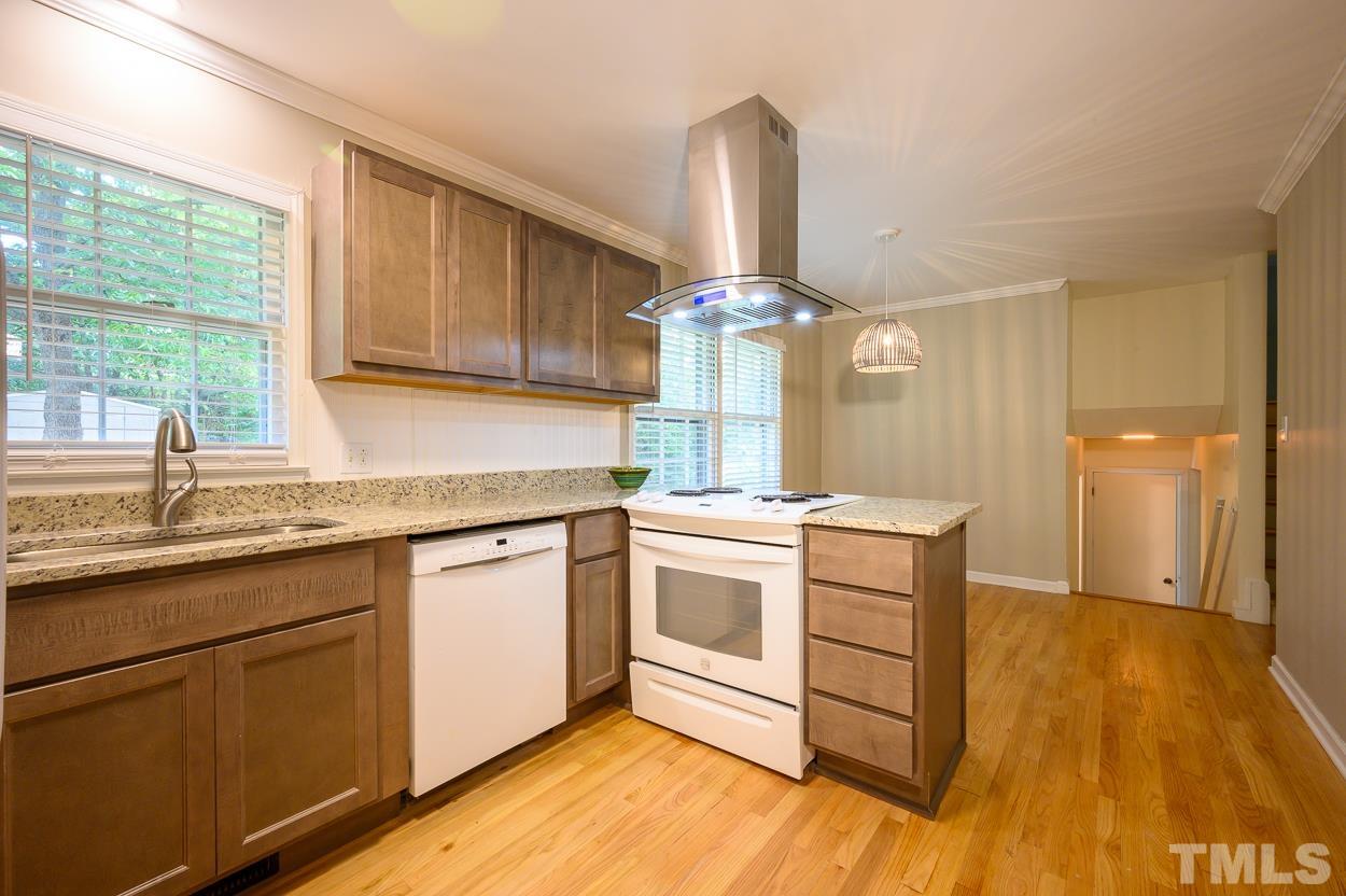 4208 Waterbury Road Raleigh, NC 27604 - Photo 11 of 24 a kitchen with a sink cabinets and window