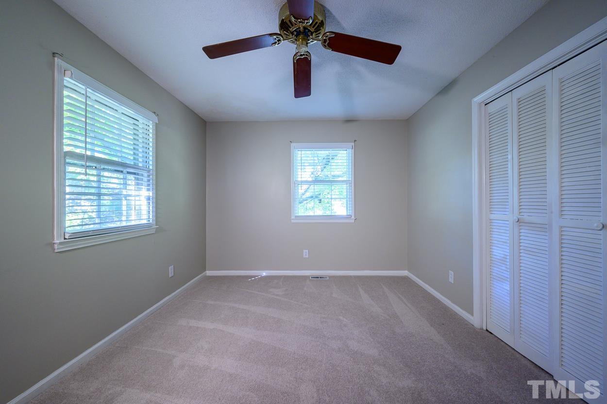 4208 Waterbury Road Raleigh, NC 27604 - Photo 12 of 24 a view of an empty room with a window