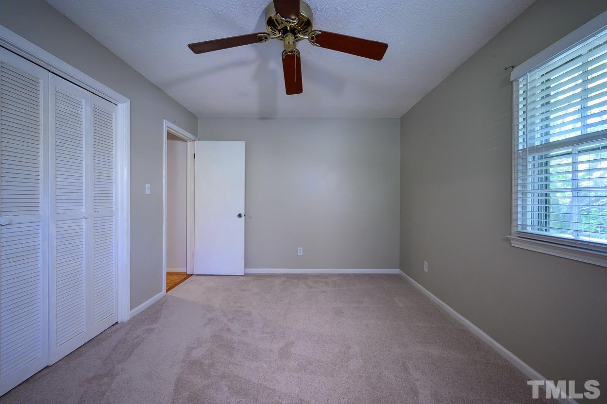 4208 Waterbury Road Raleigh, NC 27604 - Photo 13 of 24 a view of an empty room with a window