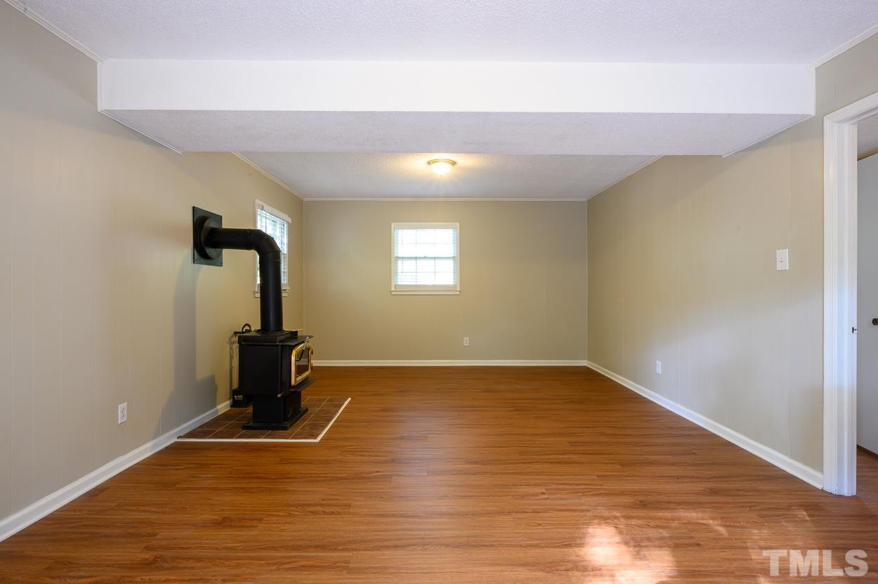 4208 Waterbury Road Raleigh, NC 27604 - Photo 18 of 24 a view of empty room with wooden floor