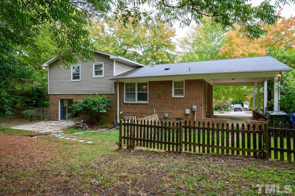 4208 Waterbury Road Raleigh, NC 27604 - Photo 23 of 24 a front view of a house with a garden