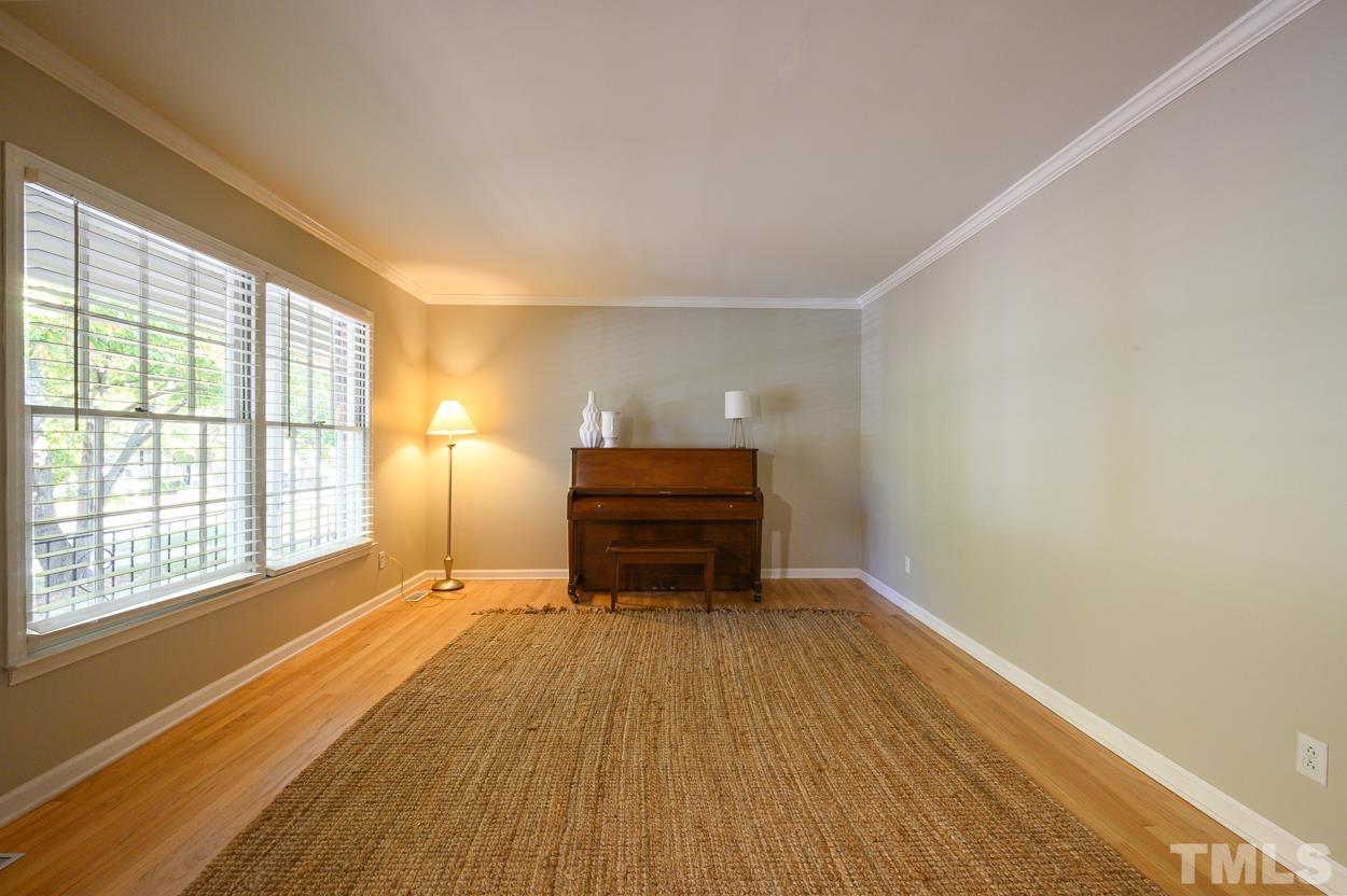 4208 Waterbury Road Raleigh, NC 27604 - Photo 7 of 24 a room with a bed and a window