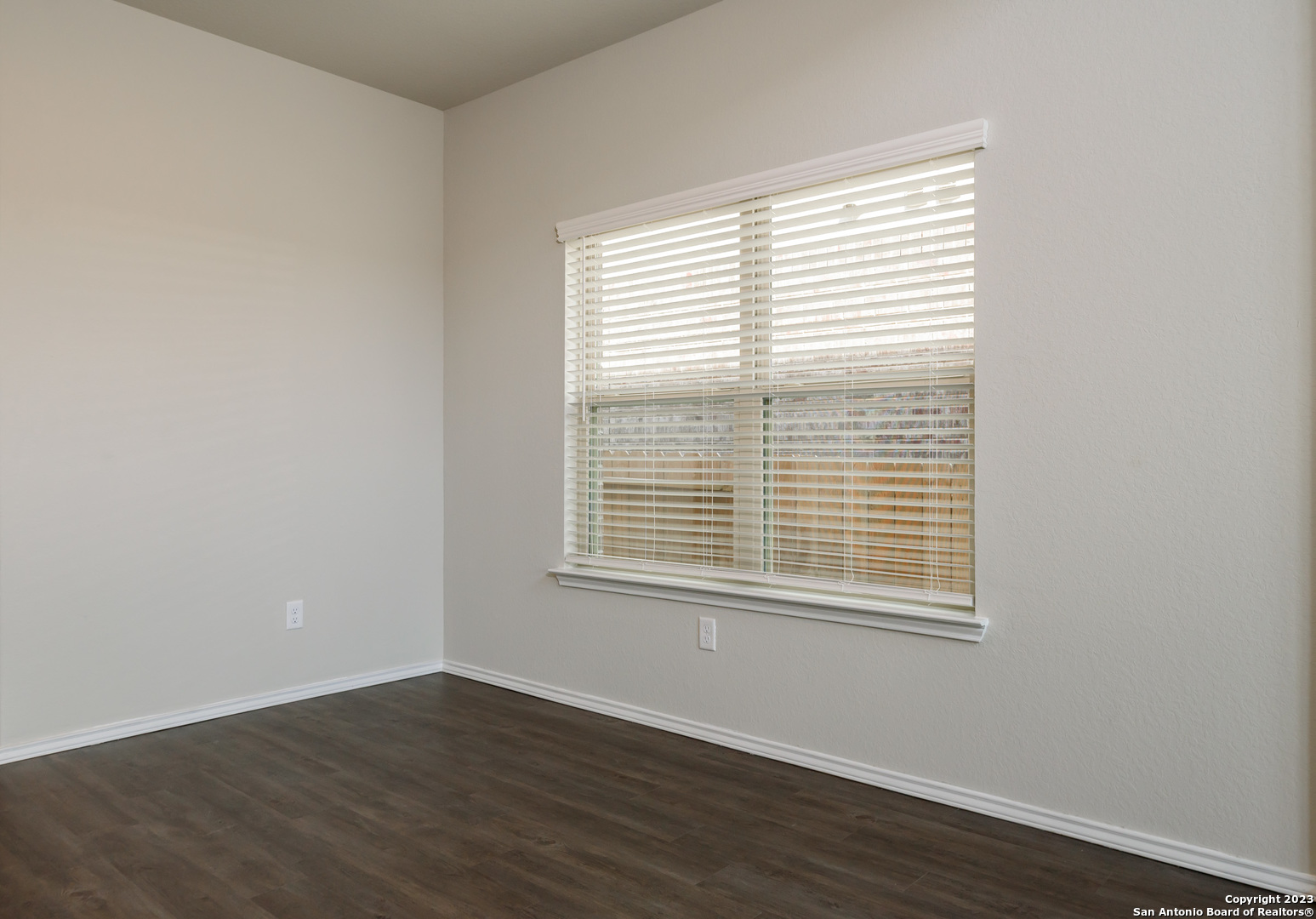 1609 Ranch House New Braunfels, TX 78132 - Photo 12 of 39 a view of an empty room with wooden floor and a window