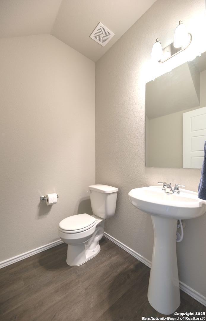 1609 Ranch House New Braunfels, TX 78132 - Photo 14 of 39 a white toilet sitting next to a bathroom sink
