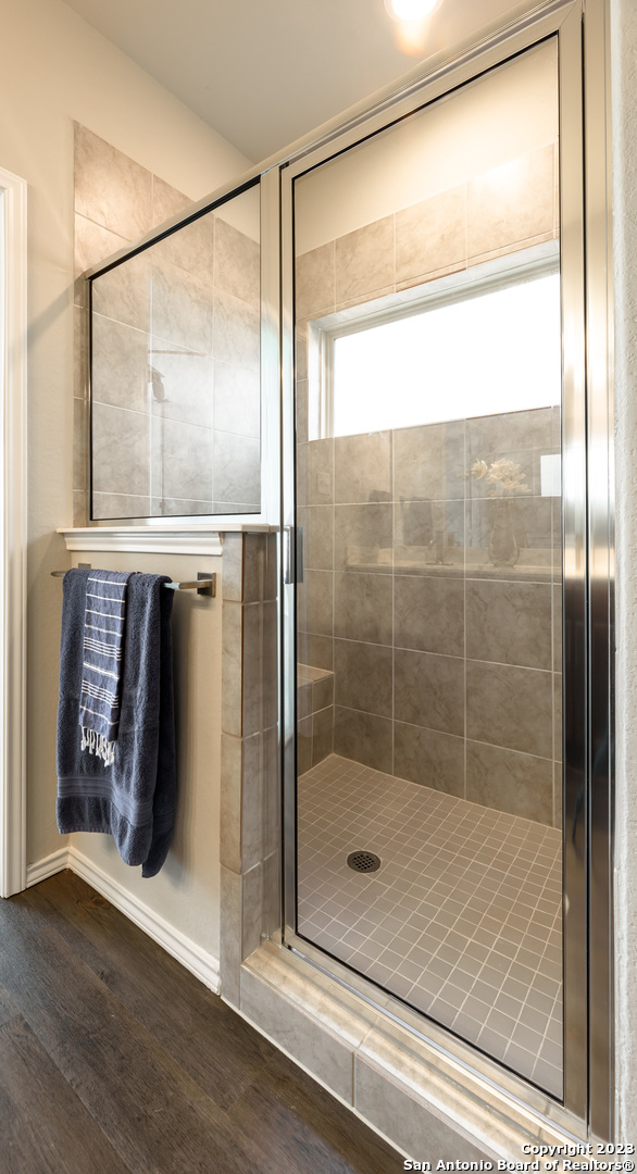 1609 Ranch House New Braunfels, TX 78132 - Photo 17 of 39 a bathroom with a glass shower door