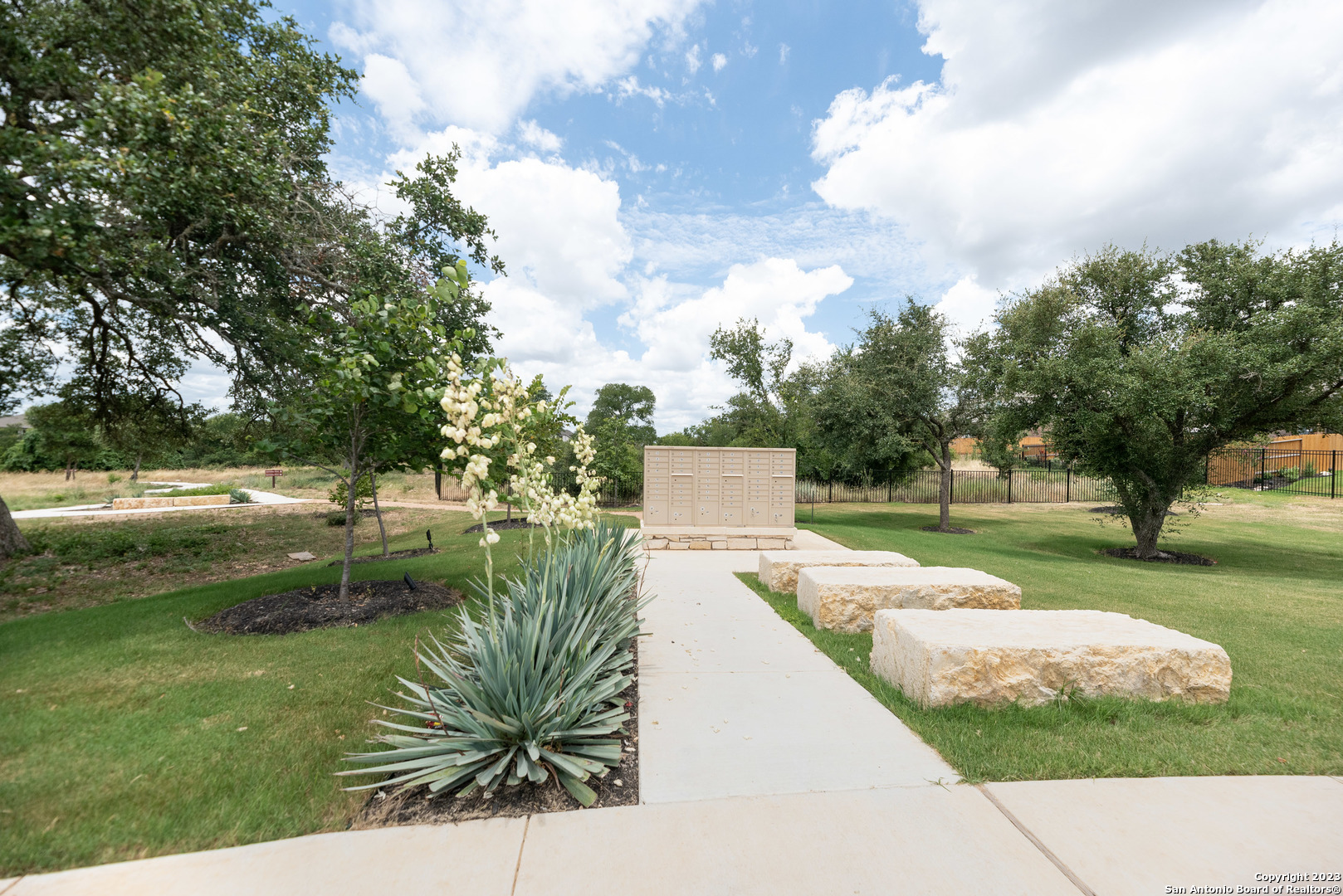 1609 Ranch House New Braunfels, TX 78132 - Photo 26 of 39 a view of swimming pool with a garden and trees