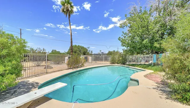 a view of a swimming pool with a patio