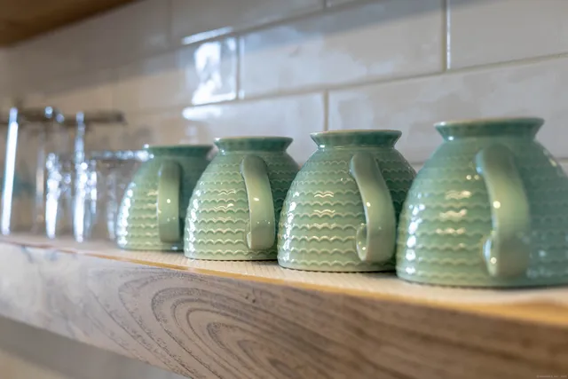 a view of water heater room with staircase