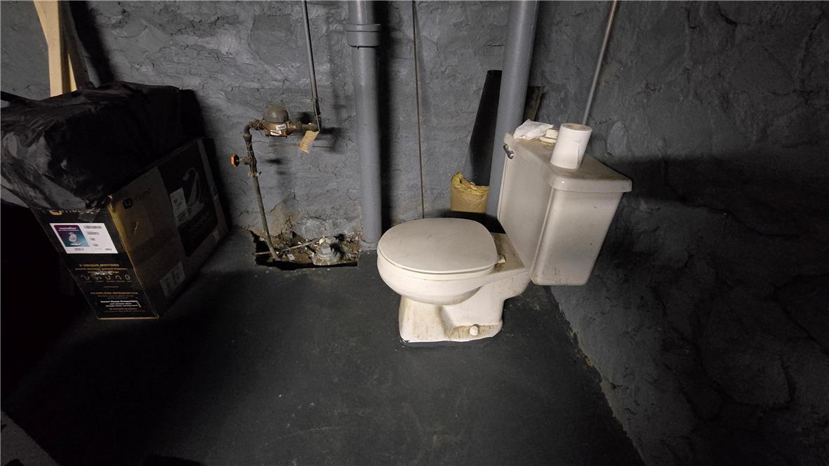 883 North Locust Street Hazleton, PA 18201 - Photo 79 of 83 A utilitarian commode in a basement, ready for renovation.