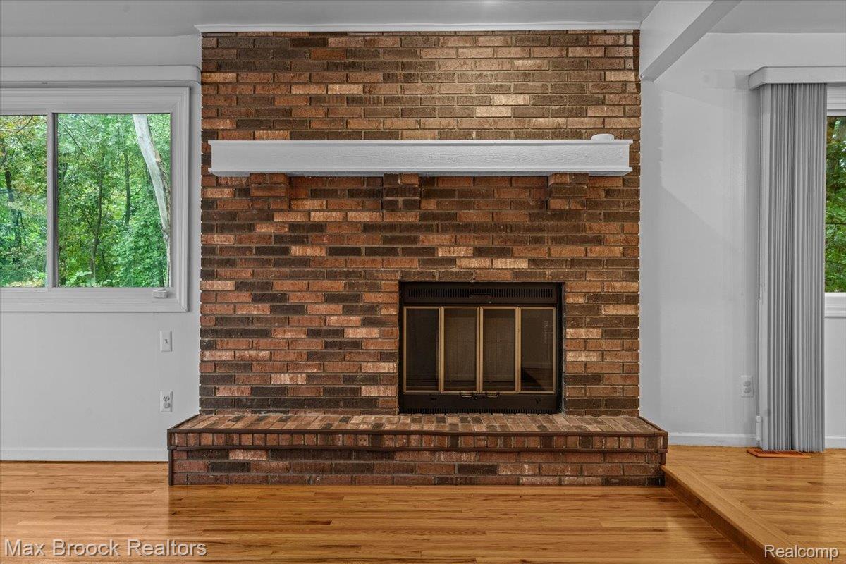 1830 Lone Pine Road Bloomfield Hills, MI 48302 - Photo 12 of 70 Brick-faced fireplace with hearth and integrated mantel