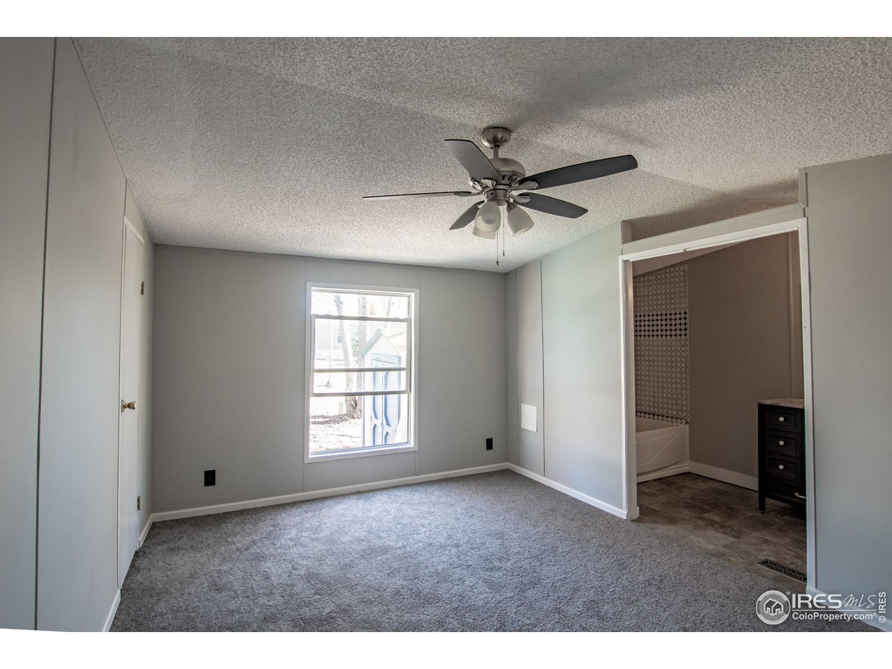 4904 Eagle Crest Boulevard, Unit 221 Firestone, CO 80504 - Photo 11 of 25 a view of an empty room with a window