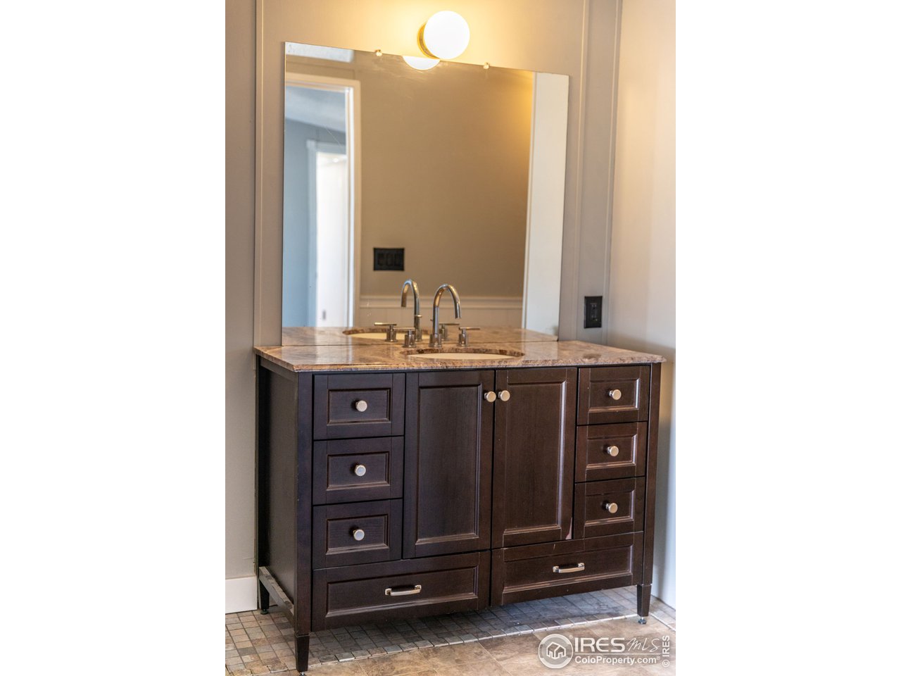 4904 Eagle Crest Boulevard, Unit 221 Firestone, CO 80504 - Photo 14 of 25 a bathroom with a sink and a mirror