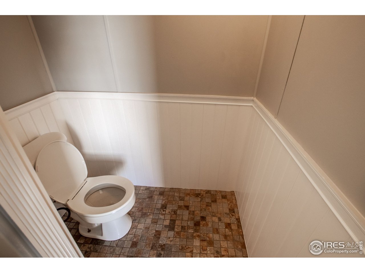 4904 Eagle Crest Boulevard, Unit 221 Firestone, CO 80504 - Photo 16 of 25 a bathroom with a toilet