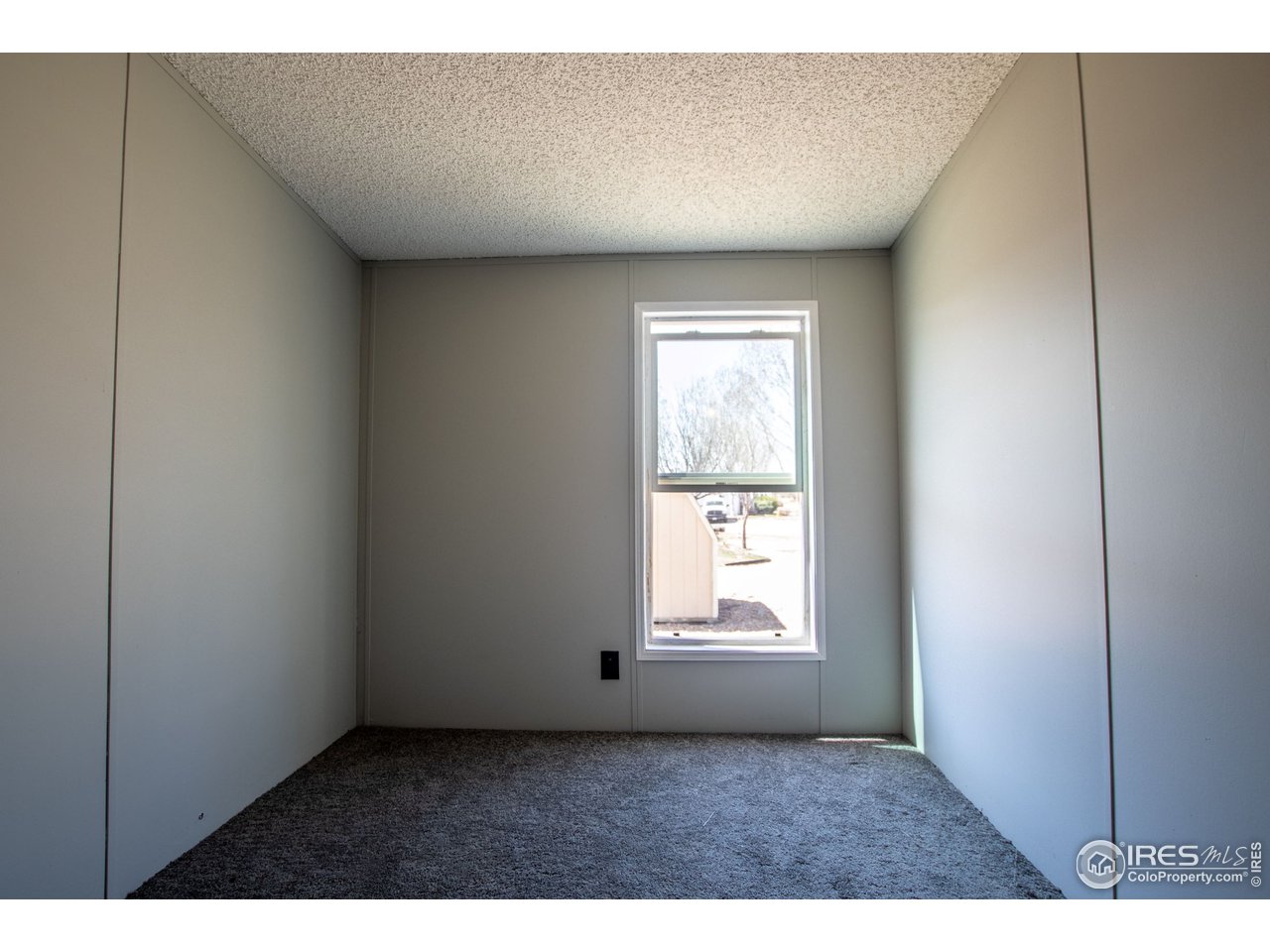 4904 Eagle Crest Boulevard, Unit 221 Firestone, CO 80504 - Photo 21 of 25 a view of empty room with windows