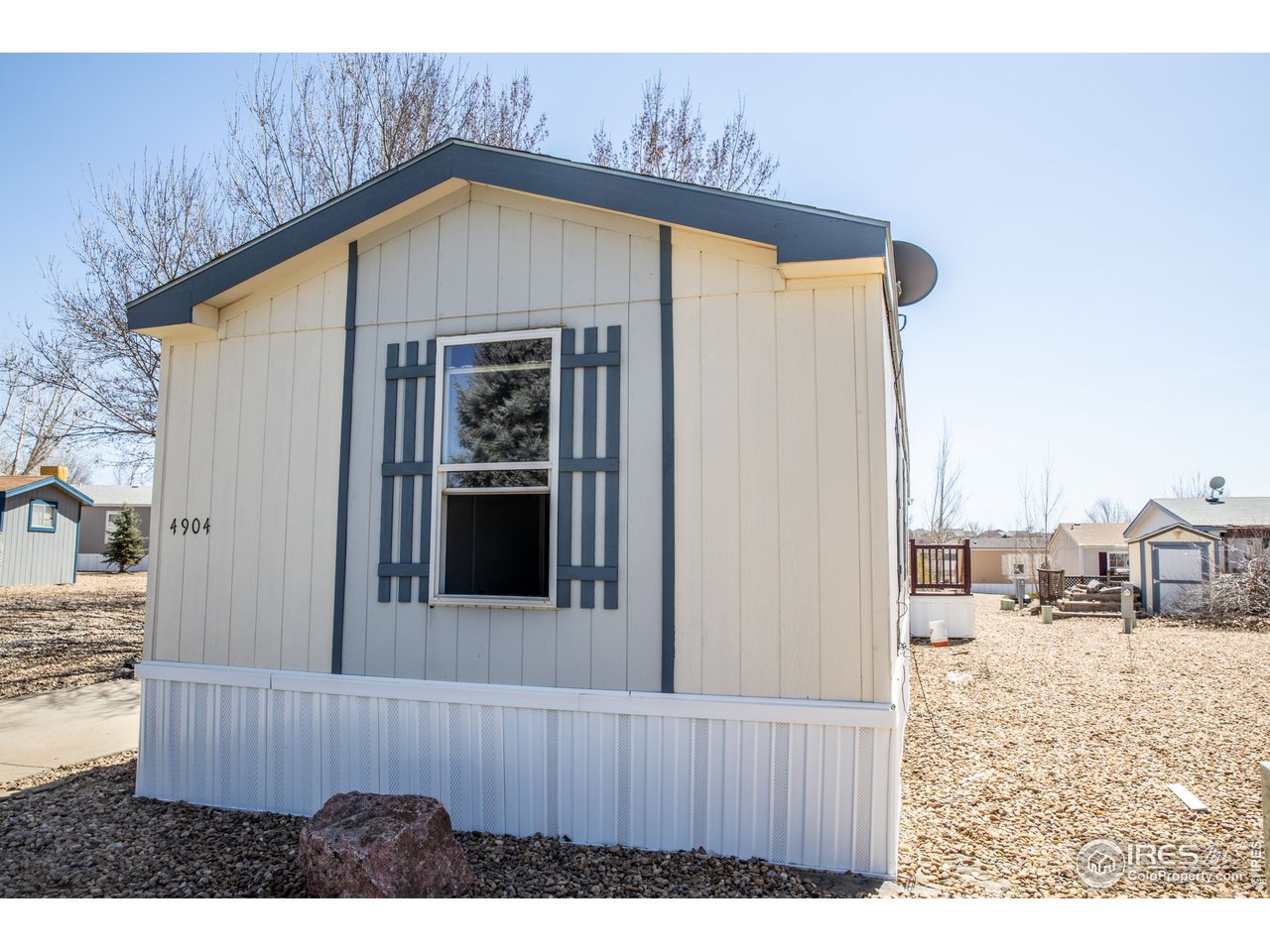 4904 Eagle Crest Boulevard, Unit 221 Firestone, CO 80504 - Photo 23 of 25 a view of a wooden house with a outdoor space