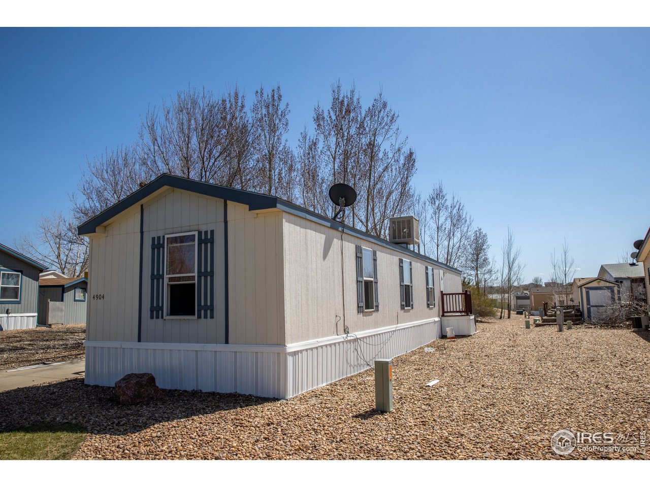 4904 Eagle Crest Boulevard, Unit 221 Firestone, CO 80504 - Photo 24 of 25 a view of a back yard of the house