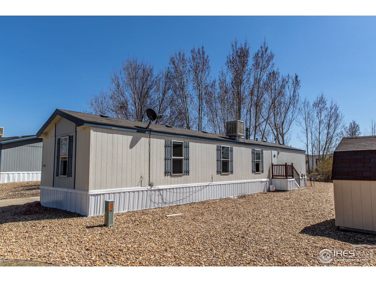 4904 Eagle Crest Boulevard, Unit 221 Firestone, CO 80504 - Photo 25 of 25 a view of a house with a backyard