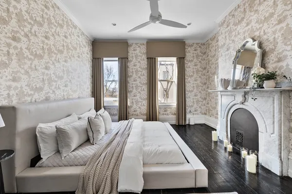 a bedroom with a bed and a fireplace