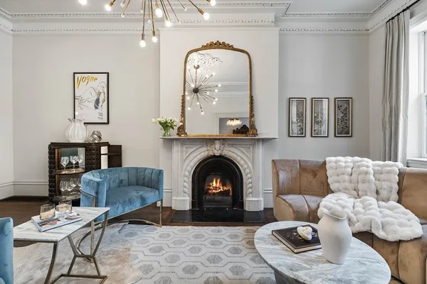 a living room with furniture and a fireplace