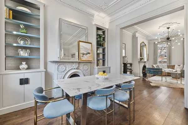 a view of a dining room with furniture and wooden floor