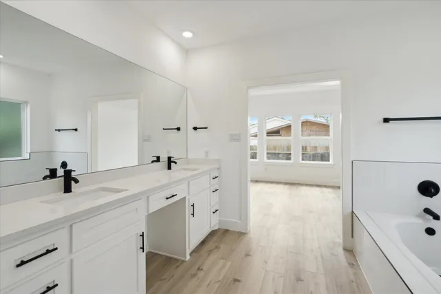 a bathroom with a bathtub and a shower