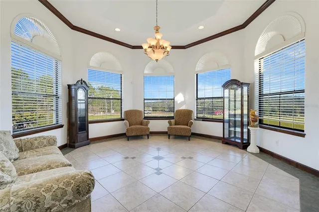 a dining area with furniture and wooden floor