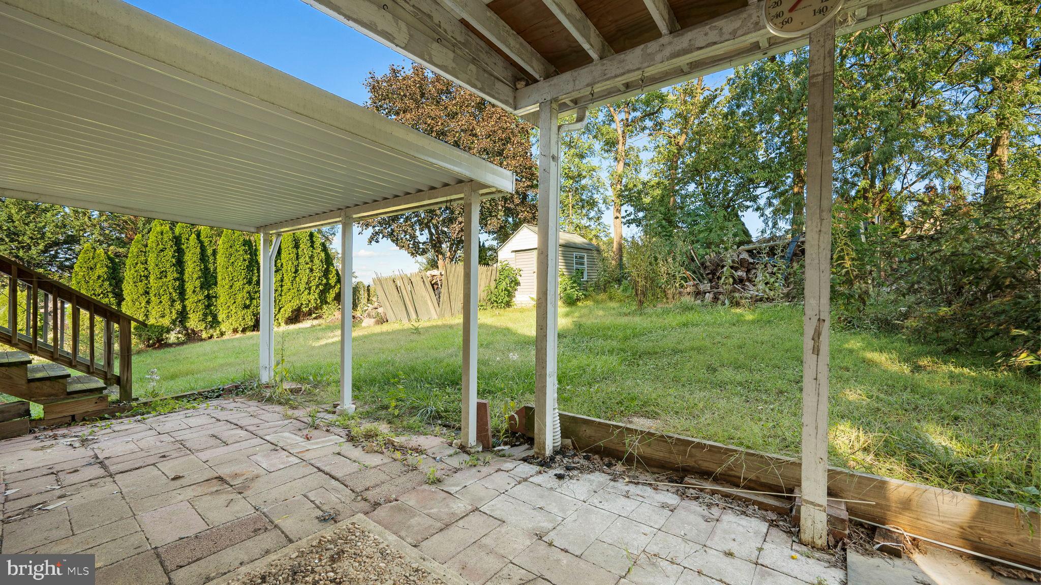 751 Ferndale Road Mount Joy, PA 17552 - Photo 23 of 32 Serene backyard retreat with lush greenery.