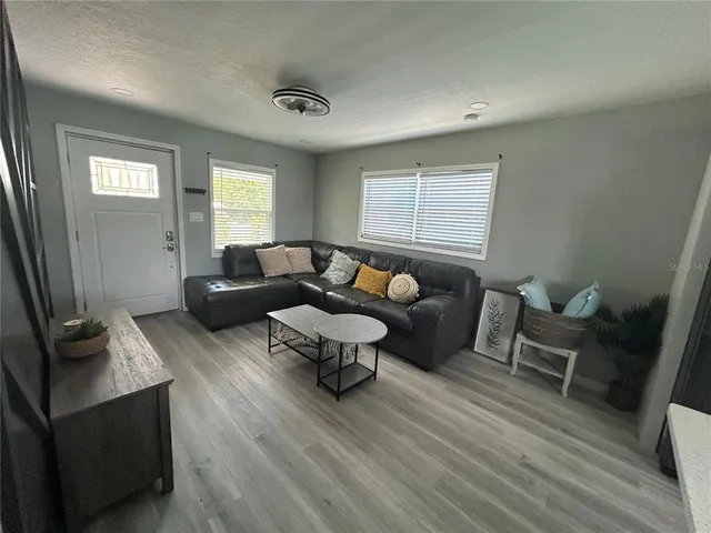 a kitchen with stainless steel appliances a refrigerator sink and microwave