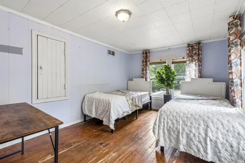 a bedroom with a bed and a table