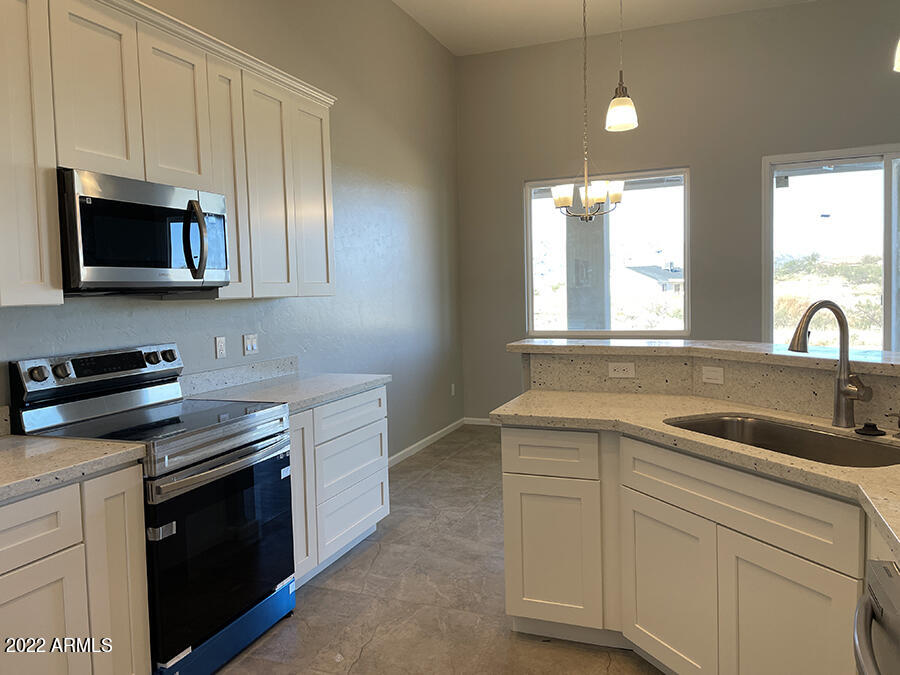 1736 Faro Court Rio Rico, AZ 85648 - Photo 6 of 20 kitchen sink-range wall
