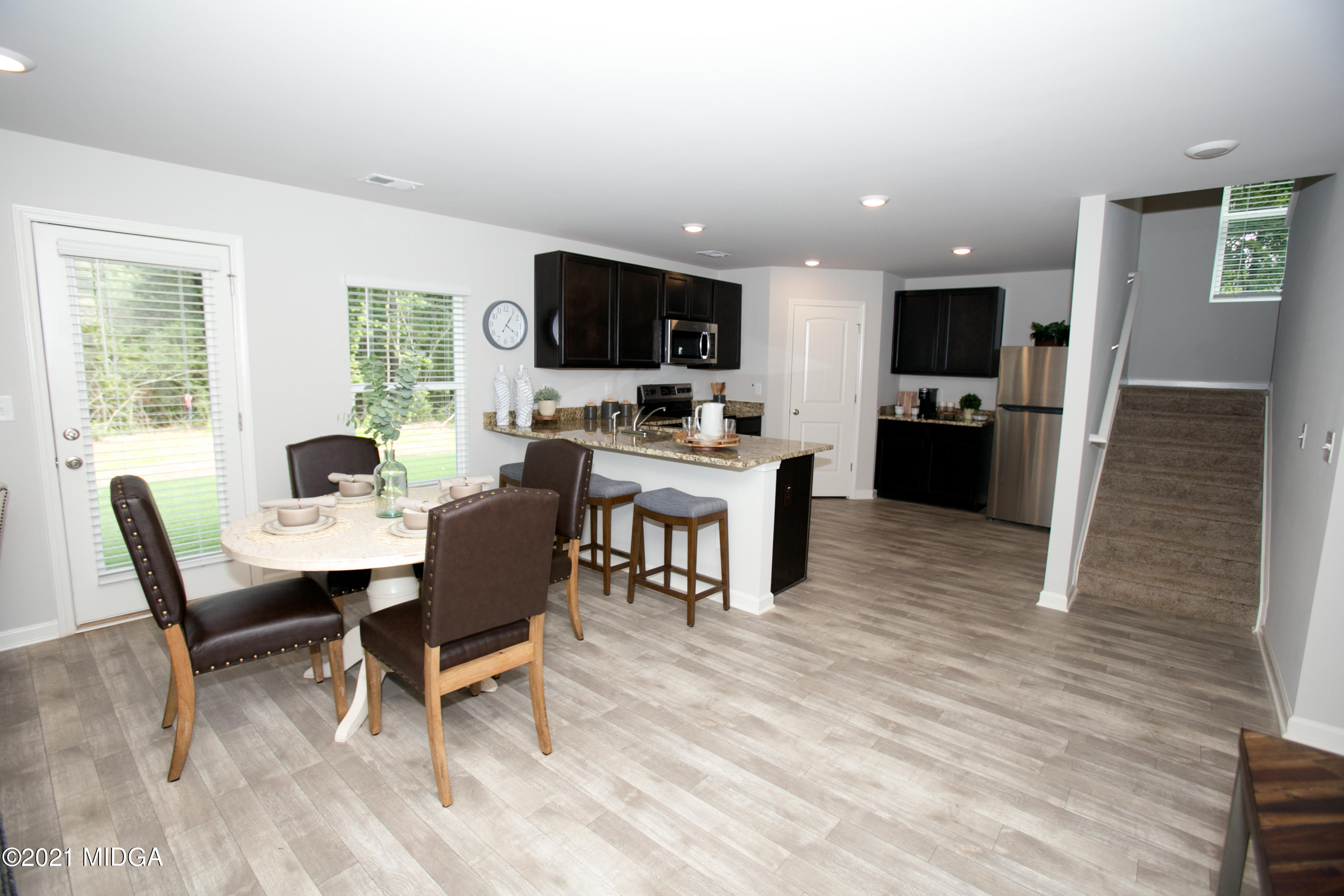 103 Sara Kay Lane, Unit 37 Macon, GA 31210 - Photo 11 of 38 a view of a dining room with furniture window and wooden floor
