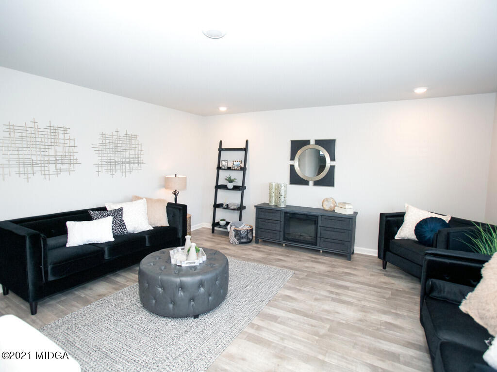 103 Sara Kay Lane, Unit 37 Macon, GA 31210 - Photo 12 of 38 a living room with furniture and a potted plant