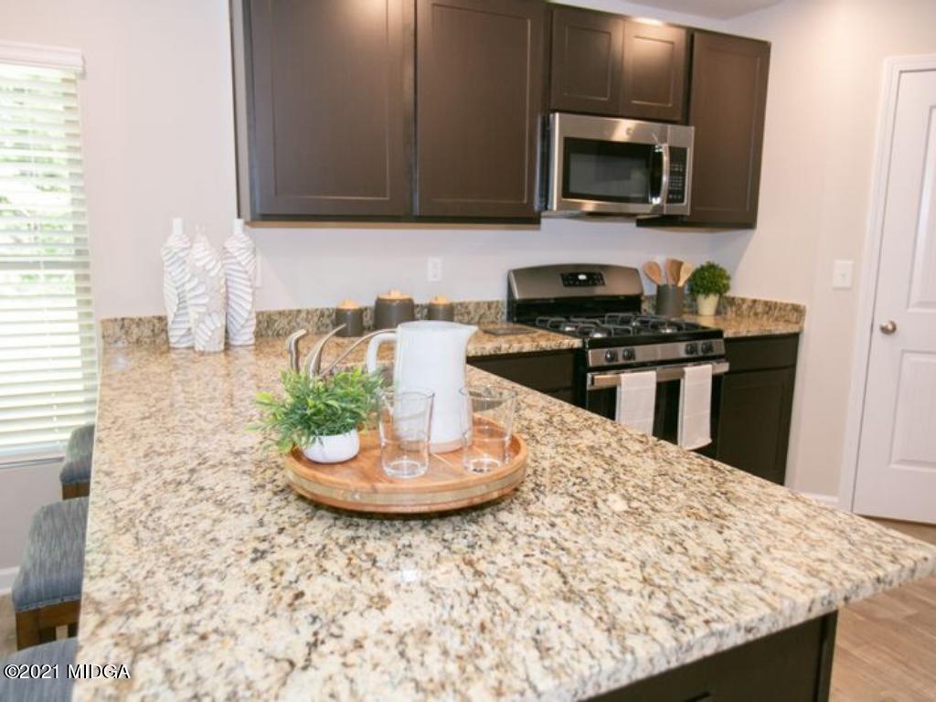 103 Sara Kay Lane, Unit 37 Macon, GA 31210 - Photo 17 of 38 a kitchen with a stove and a microwave