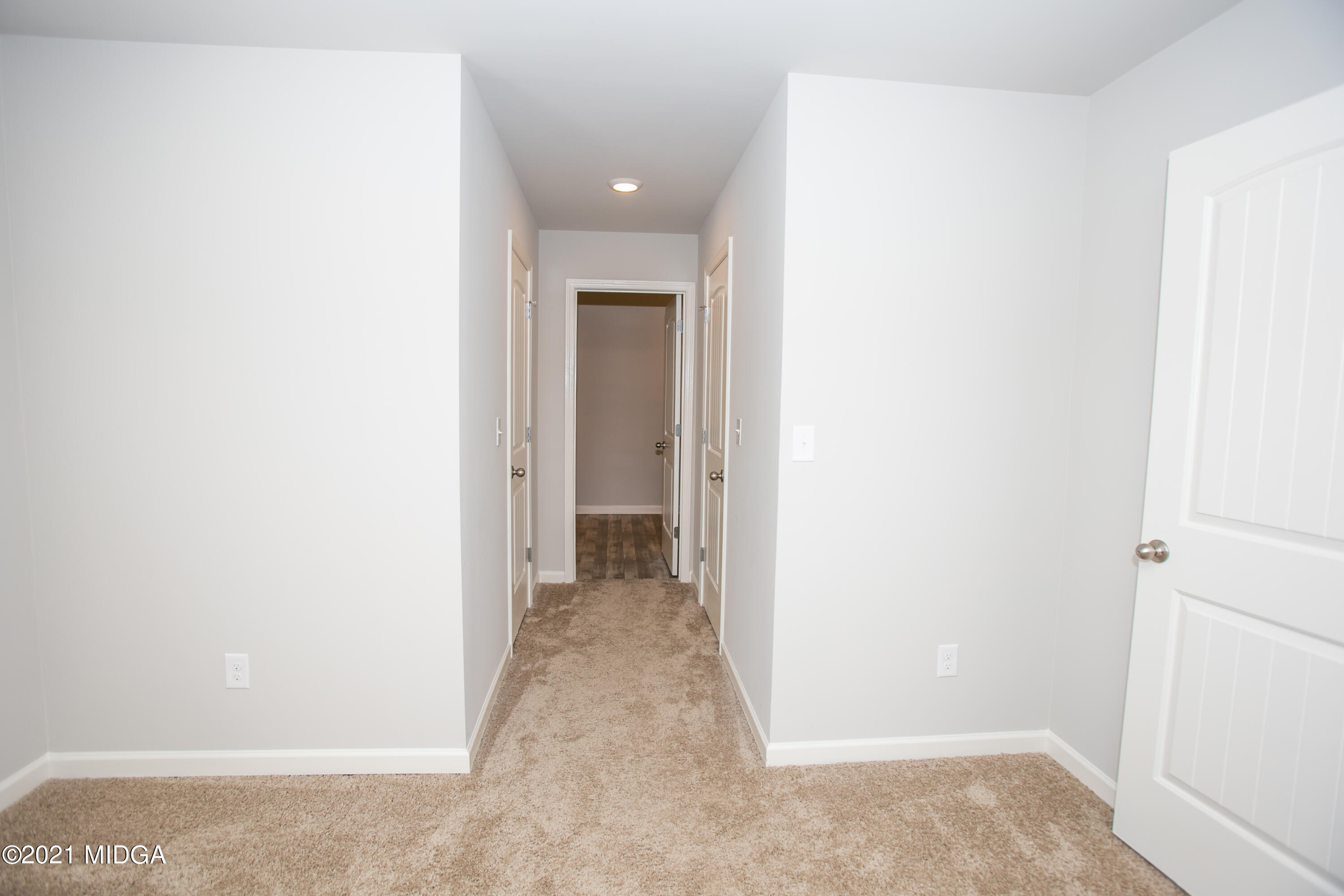 103 Sara Kay Lane, Unit 37 Macon, GA 31210 - Photo 29 of 38 a view of a hallway with wooden floor