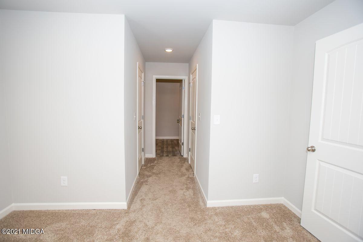 103 Sara Kay Lane, Unit 37 Macon, GA 31210 - Photo 30 of 38 a view of a hallway with wooden floor
