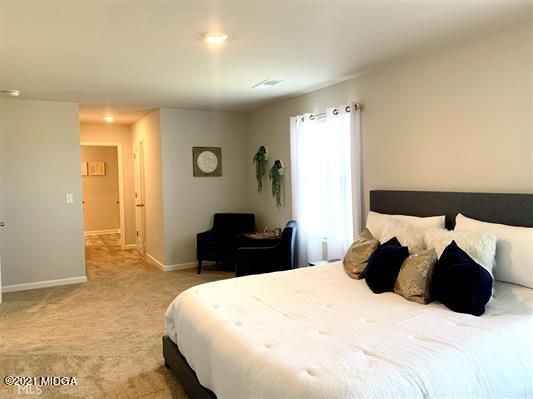 103 Sara Kay Lane, Unit 37 Macon, GA 31210 - Photo 35 of 38 a bedroom with a bed and a painting