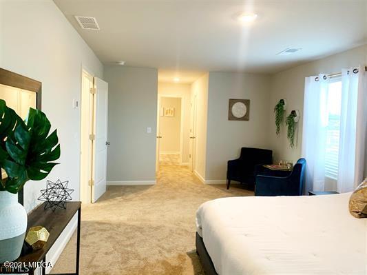 103 Sara Kay Lane, Unit 37 Macon, GA 31210 - Photo 36 of 38 a bedroom with a bed table and chair