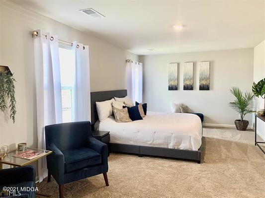 103 Sara Kay Lane, Unit 37 Macon, GA 31210 - Photo 37 of 38 a bedroom with a bed window and couch