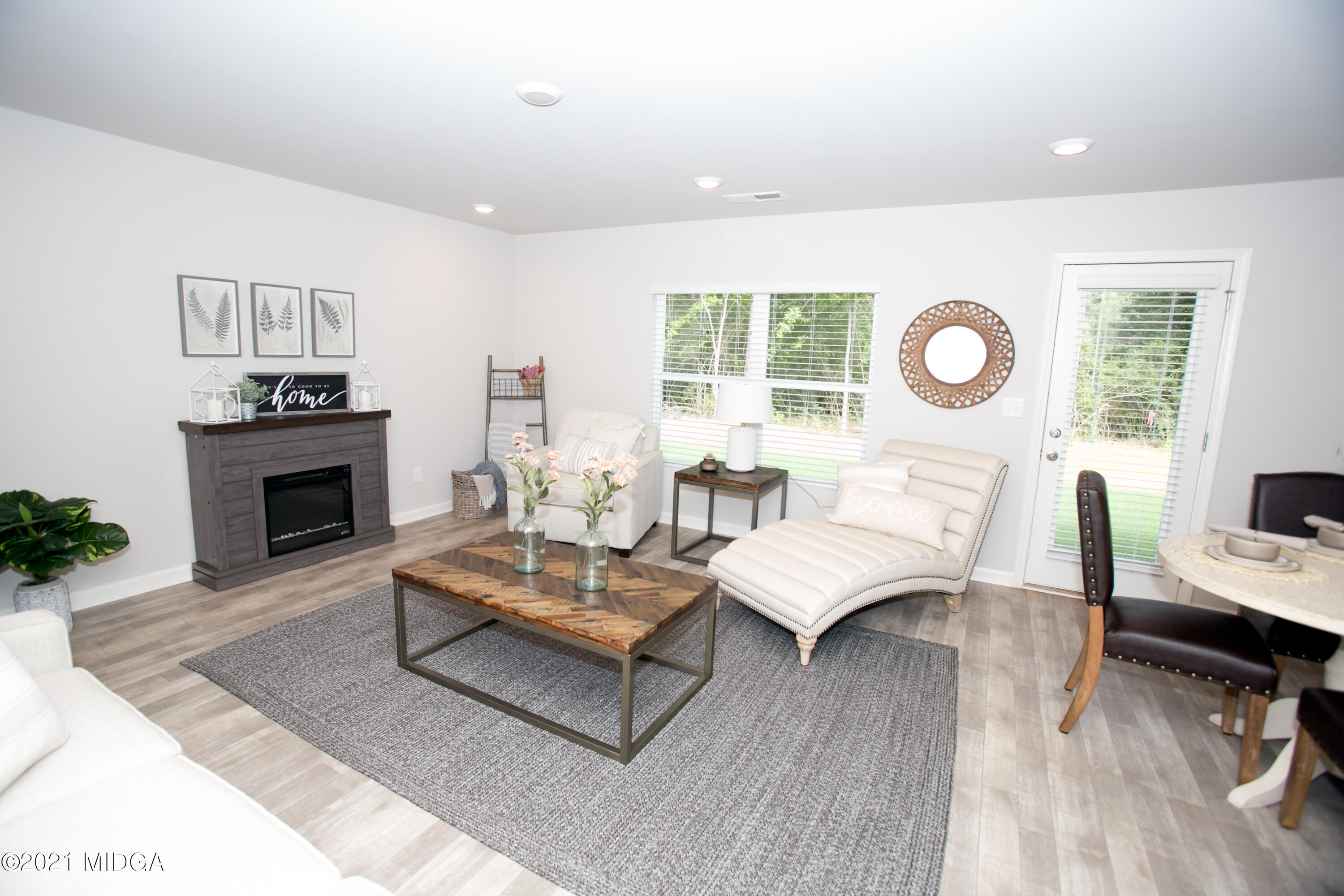103 Sara Kay Lane, Unit 37 Macon, GA 31210 - Photo 8 of 38 a living room with furniture a fireplace and a flat screen tv