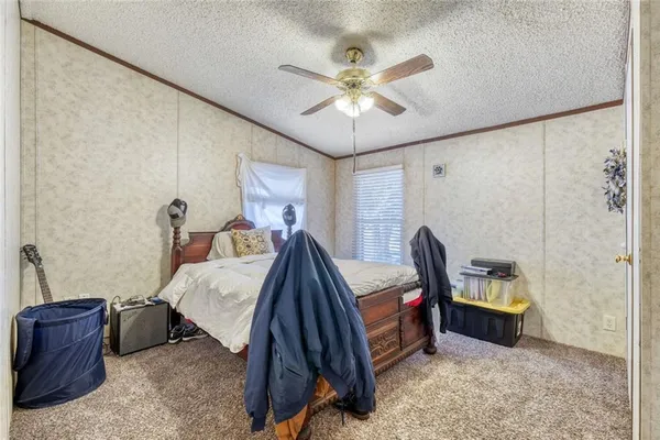 a bed room with a bed and a window