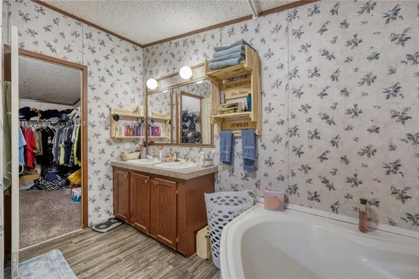 a bathroom with a sink toilet and mirror