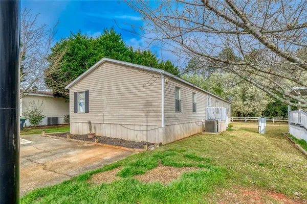 a view of a backyard with a small cabin