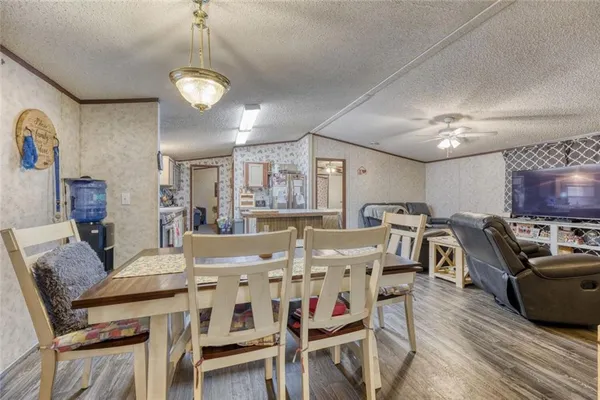 a view of a dining room with furniture and wooden floor