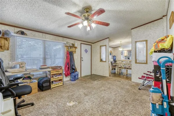 a room with furniture and gym equipment