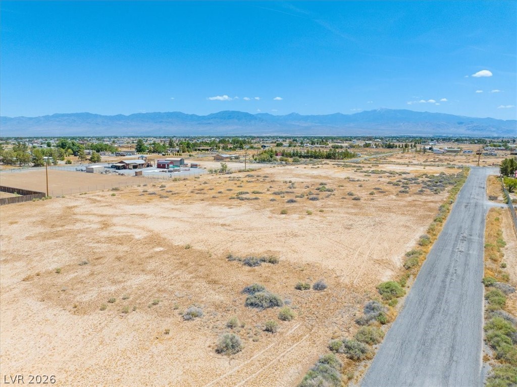 4610 Lawrence Road Pahrump, NV 89048 - Photo 2 of 42 A vast, level parcel with distant mountains and clear skies awaits your vision.