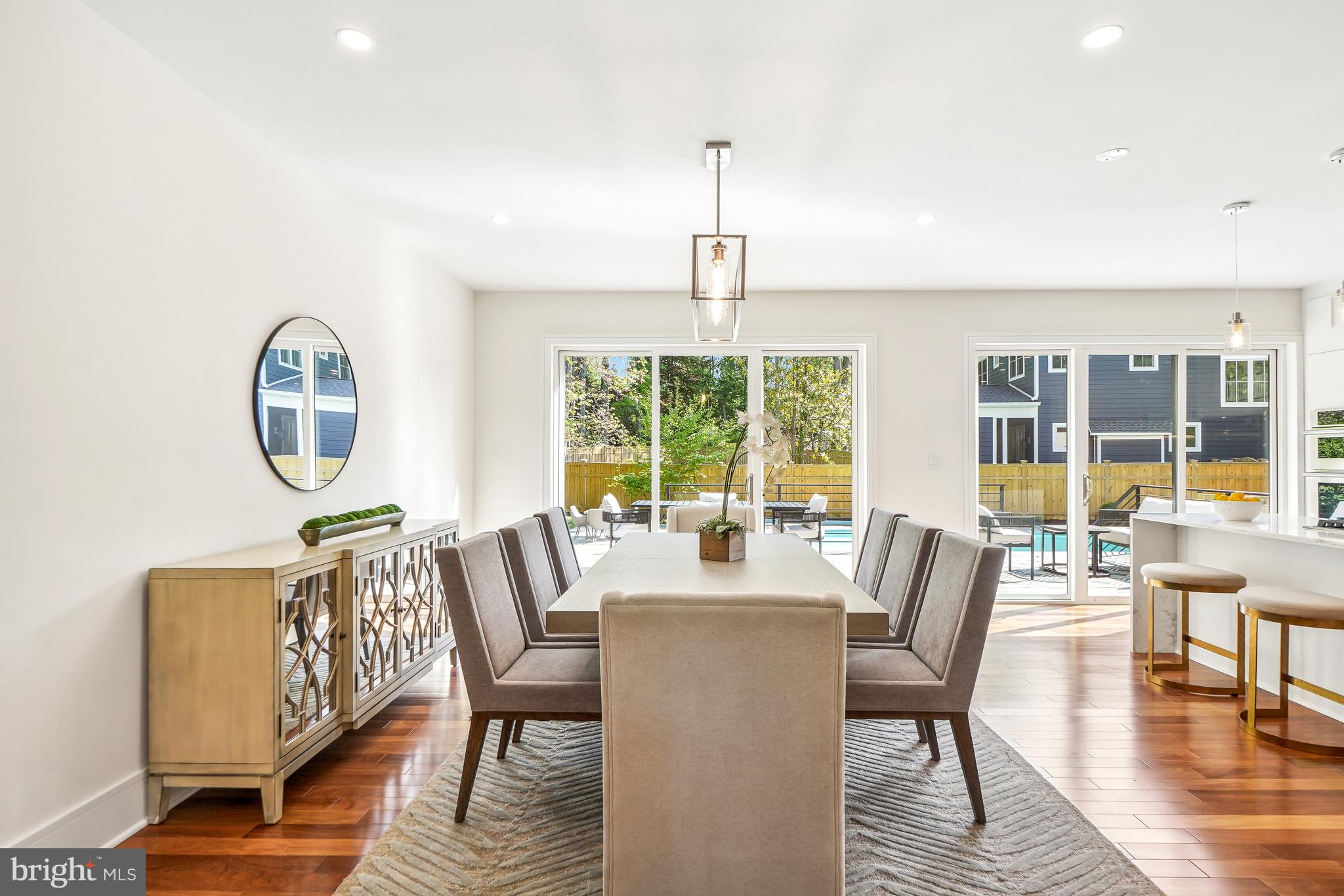 7301 Marbury Road Bethesda, MD 20817 - Photo 11 of 81 a dining room with furniture a chandelier and wooden floor