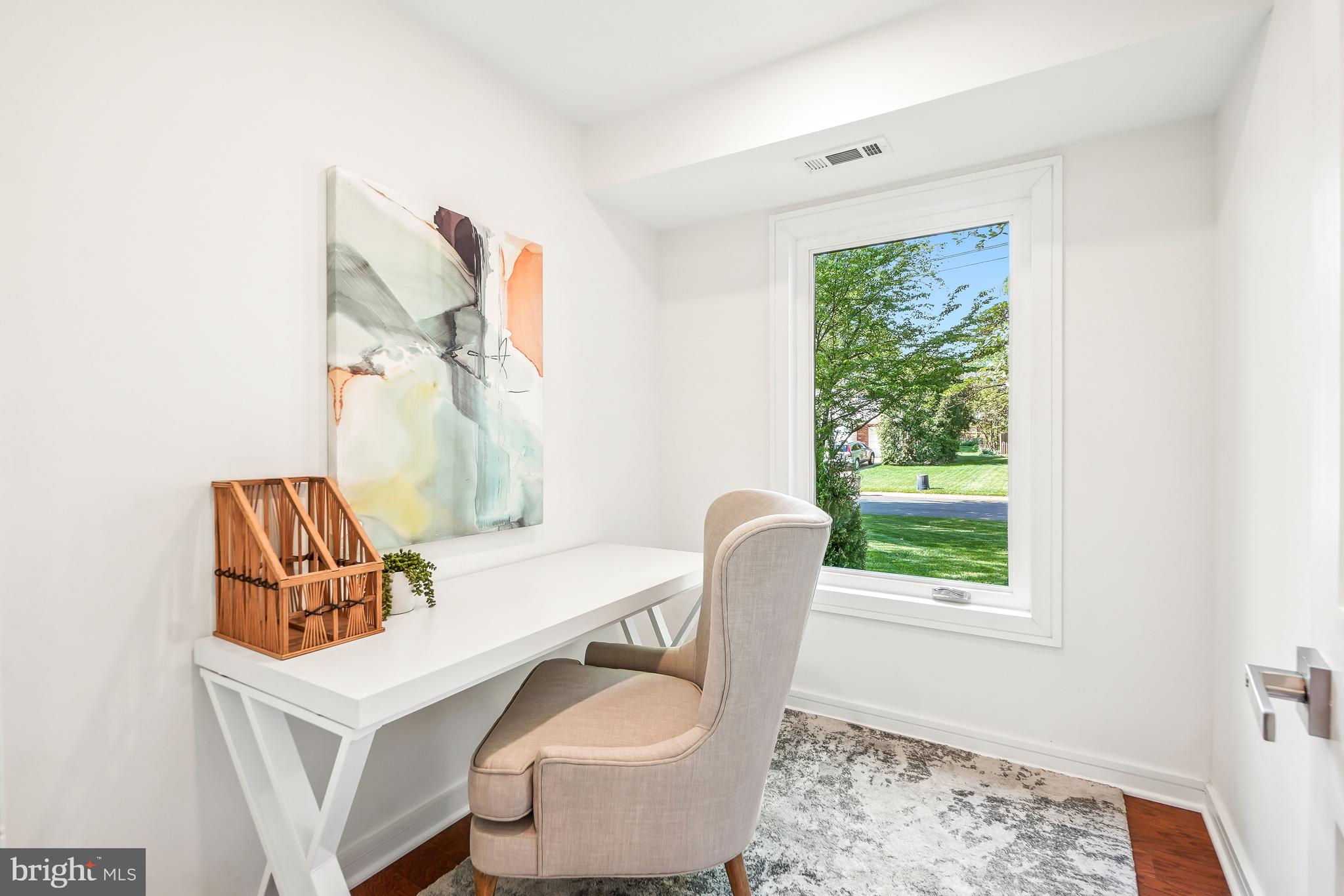 7301 Marbury Road Bethesda, MD 20817 - Photo 27 of 81 a living room with furniture and a window