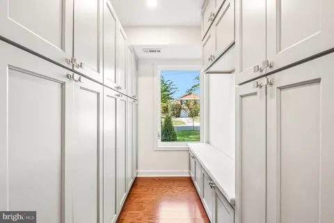 a white bath tub sitting next to a white toilet