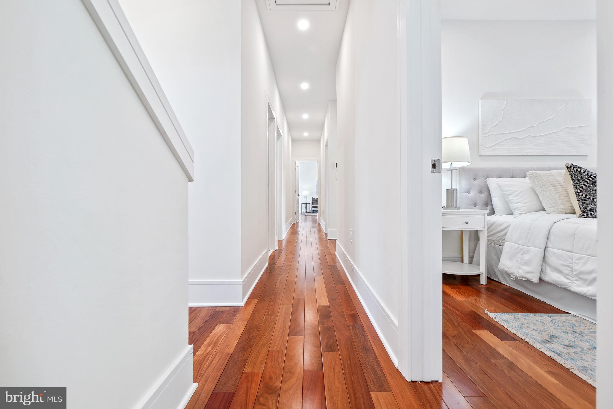 7301 Marbury Road Bethesda, MD 20817 - Photo 29 of 81 a view of a bedroom with wooden floor and staircase