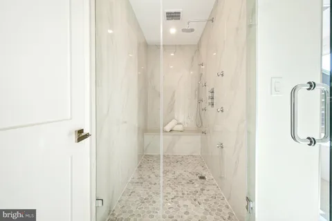 a bathroom with a sink and shower
